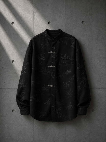Black shirt with subtle pattern on a concrete wall