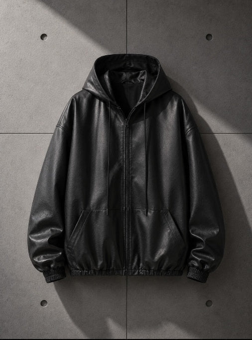 Black leather jacket on a gray concrete floor