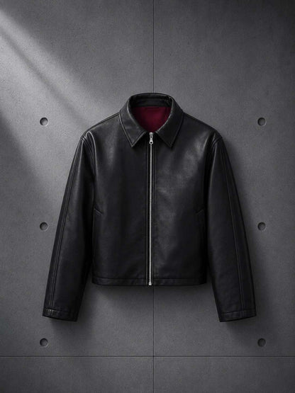 Black leather jacket on a gray concrete background