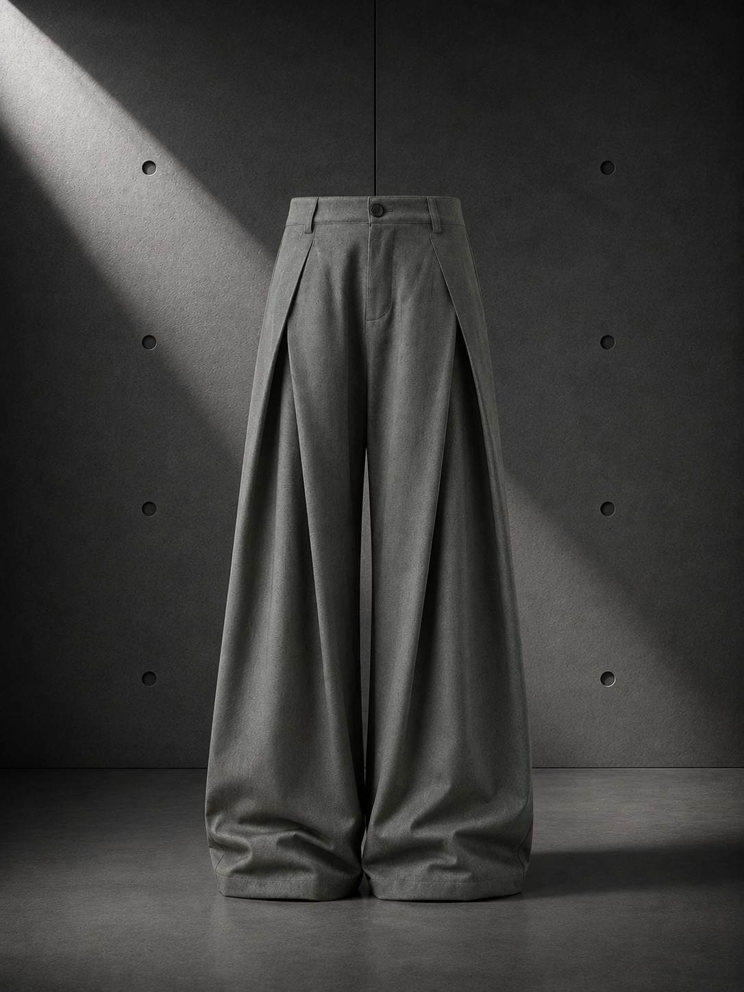 Green wide-leg pants on a dark background