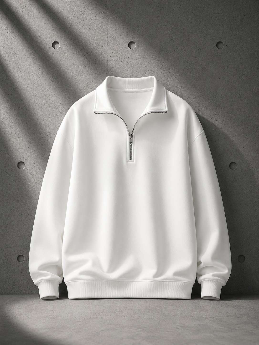 White half-zip sweatshirt on a gray background