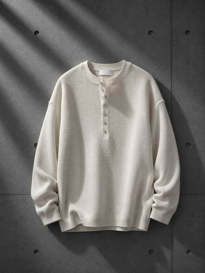 Beige long-sleeve shirt on a dark gray background