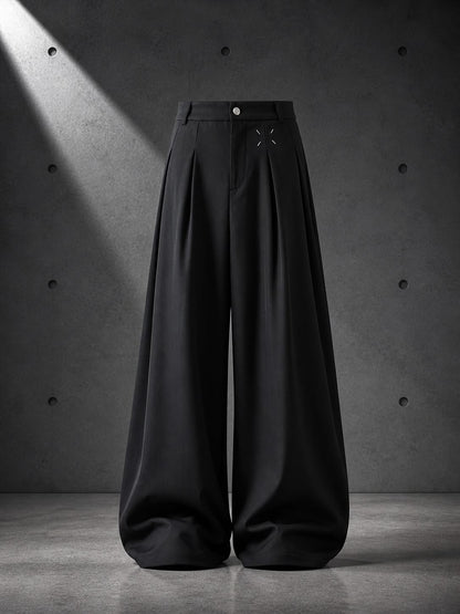 Black wide-leg pants on a gray concrete background