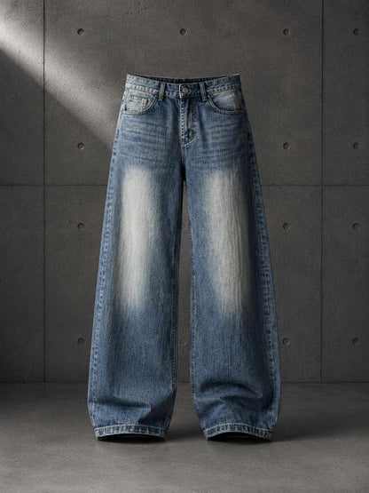 Pair of blue jeans on a gray concrete background