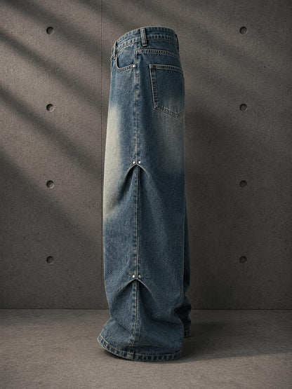 Blue denim skirt with a high slit on a gray background