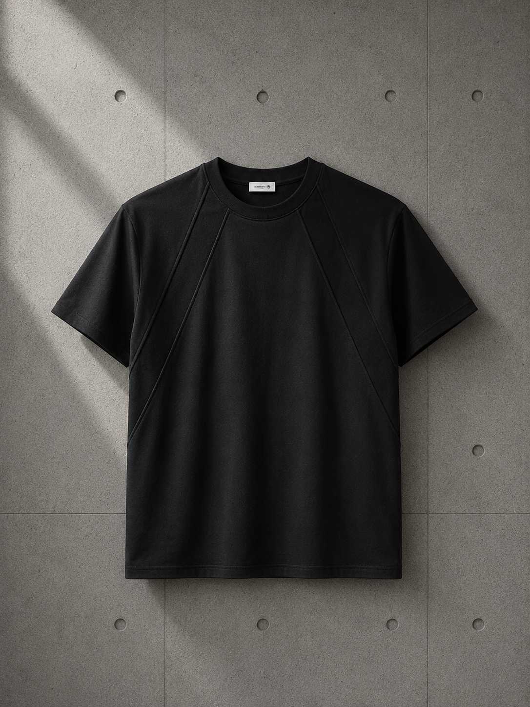 Black t-shirt on a textured gray background