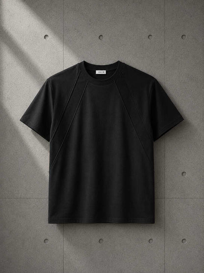 Black t-shirt on a textured gray background