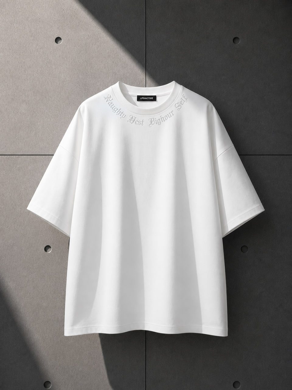 White t-shirt with text on a gray background