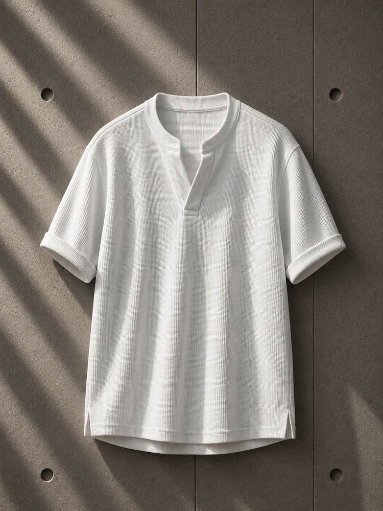 White t-shirt on a textured brown background