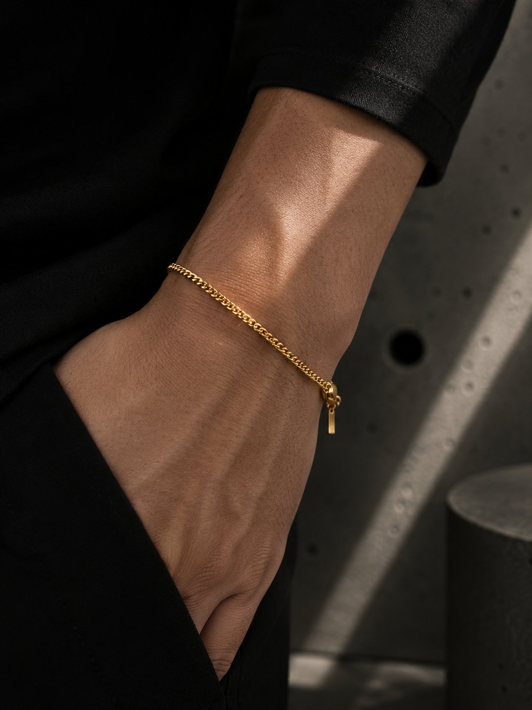 Gold bracelet on a wrist with a blurred background